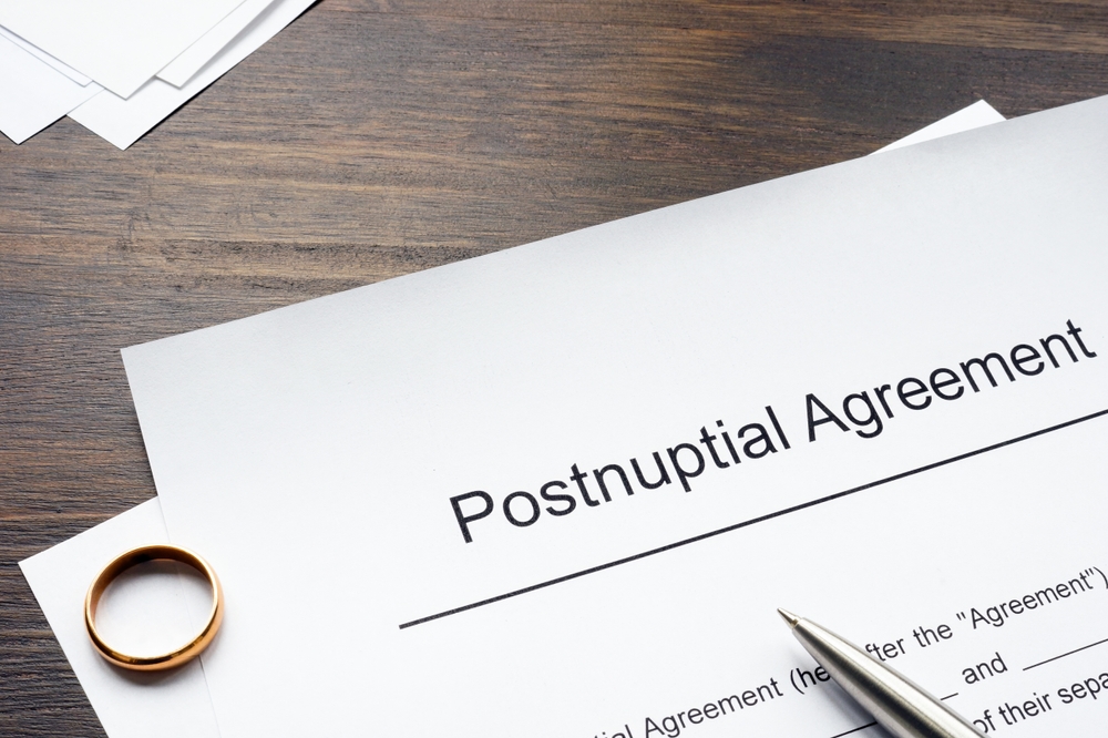Postnuptial agreement form and golden ring.